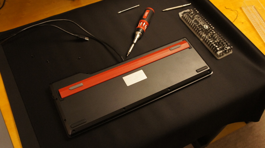 A keyboard upside down on a work surface
